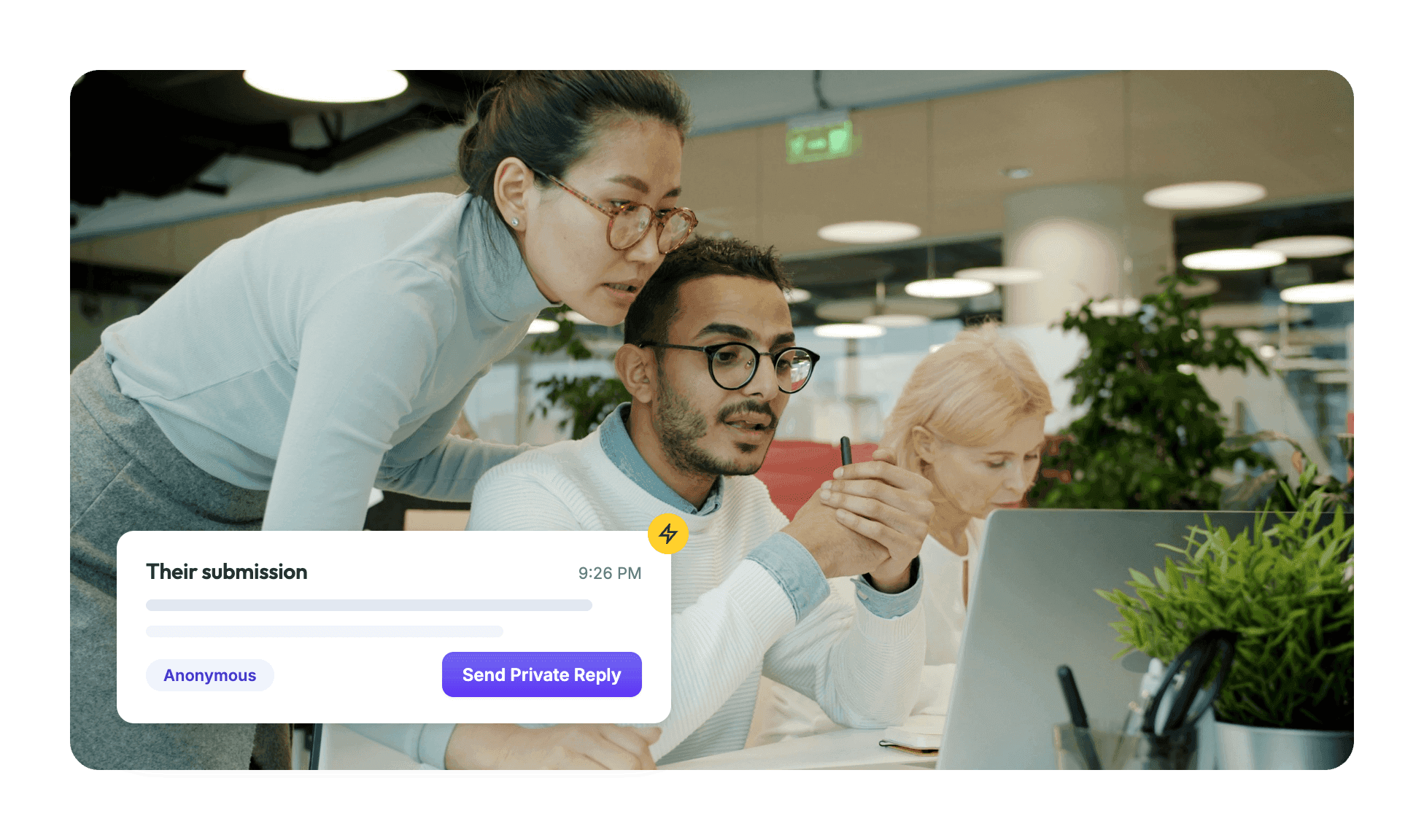 A team reviews an anonymous submission on a laptop, ready to send a private reply in Suggestion Ox